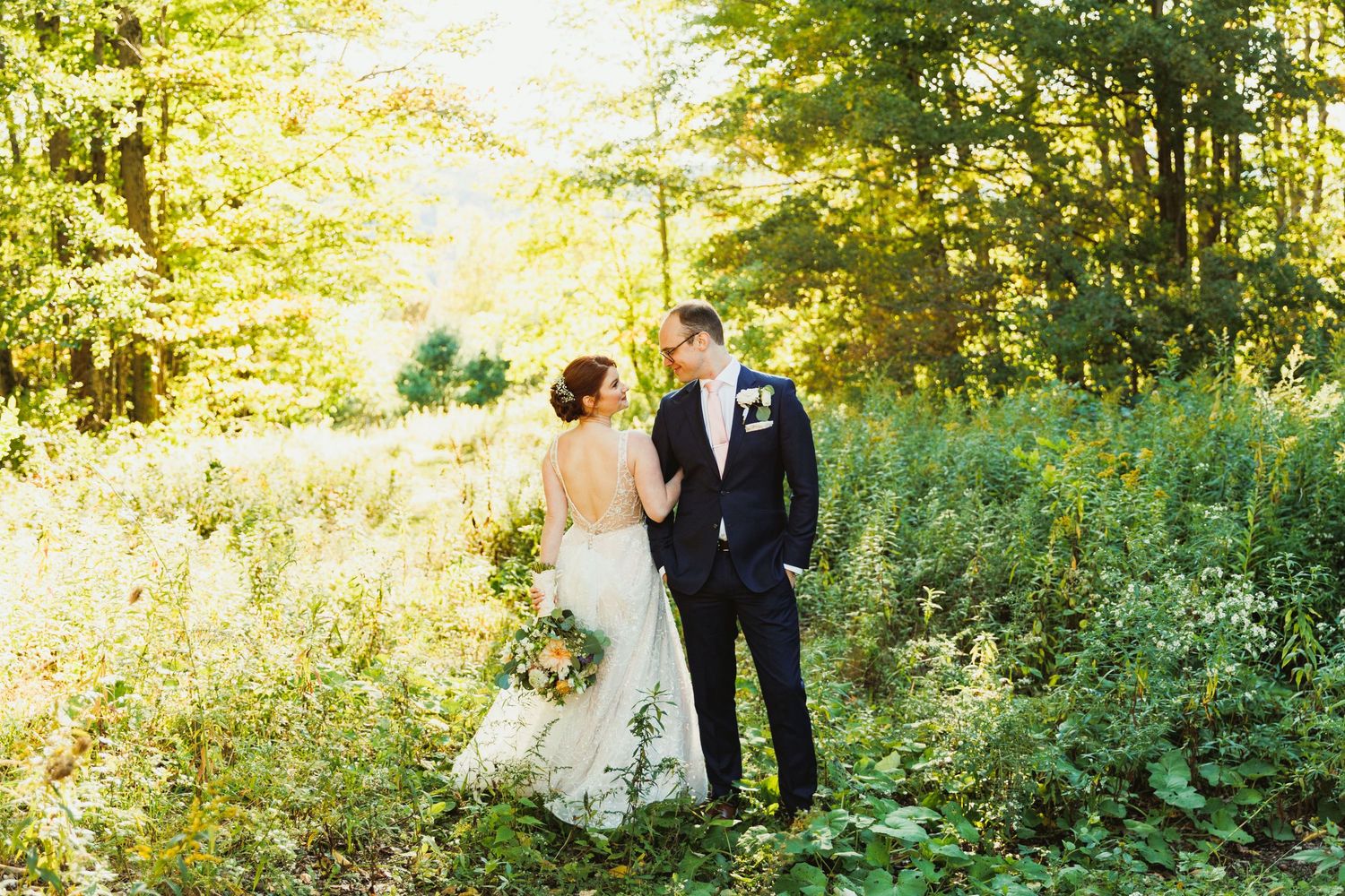 Wedding couple photographed in sequence against lush green forest backdrop.