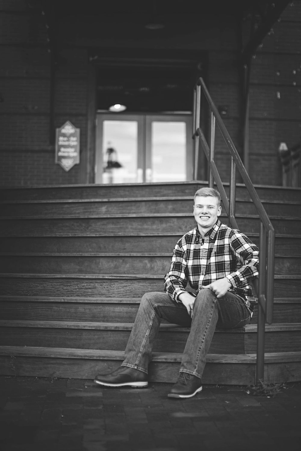 Black and white series of photos showing someone sitting on wooden steps in casual attire.