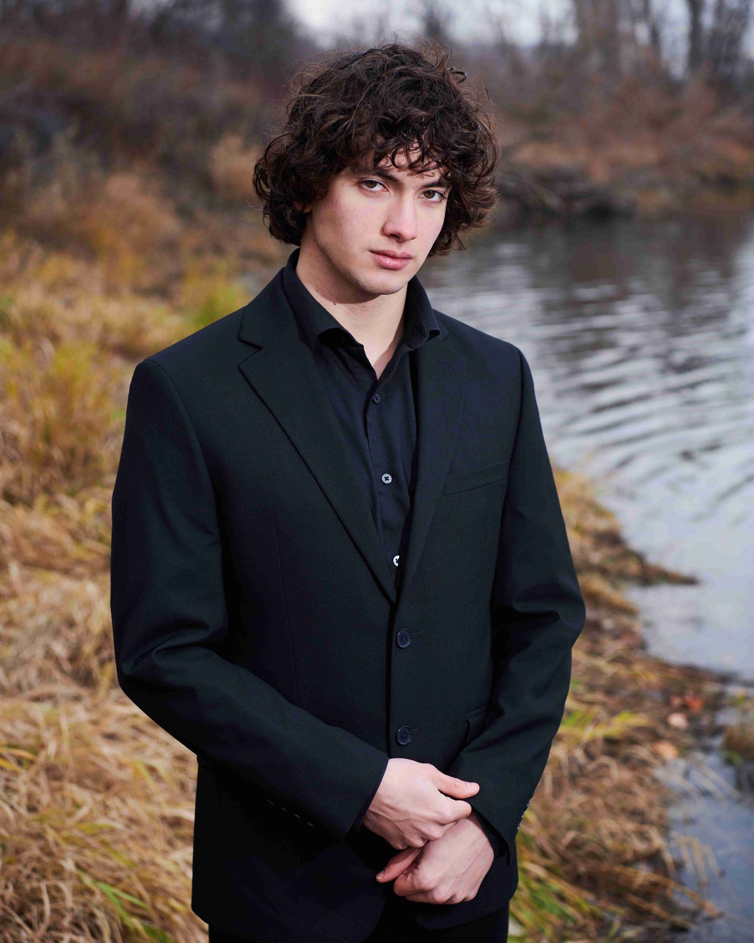 Marshall's high school senior photo on the bank of the Okanogan river in Okanogan, WA.