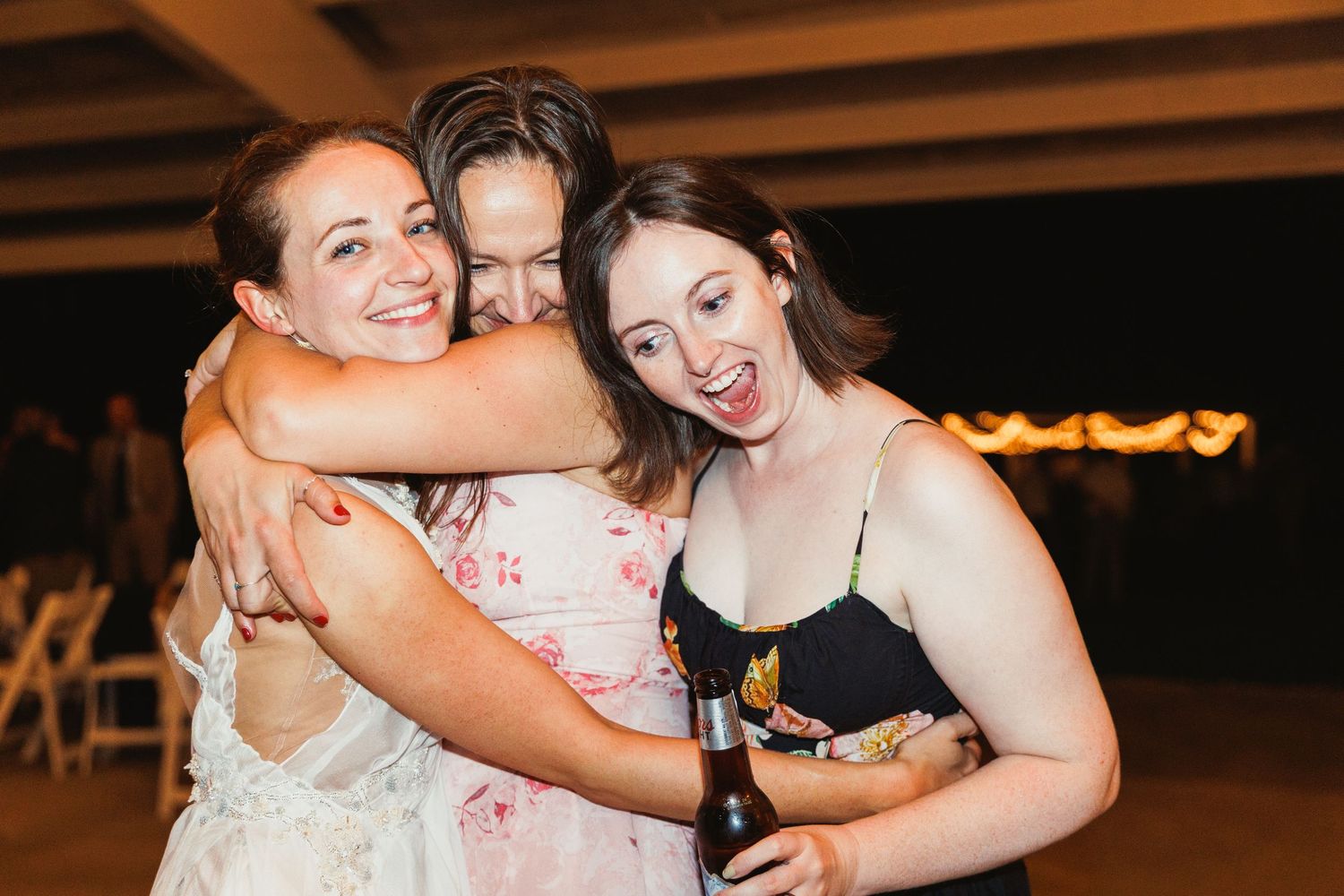 Wedding celebration at night with guests dancing and enjoying the festivities.