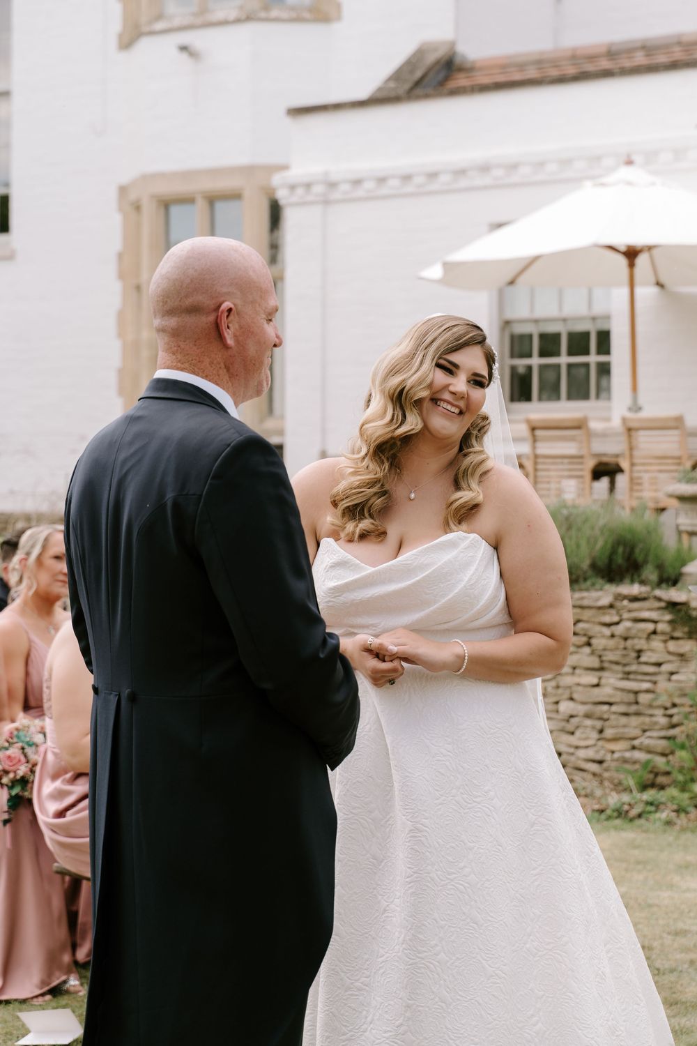 Wedding ceremony moments captured outside at Cotswold Wedding venue.
