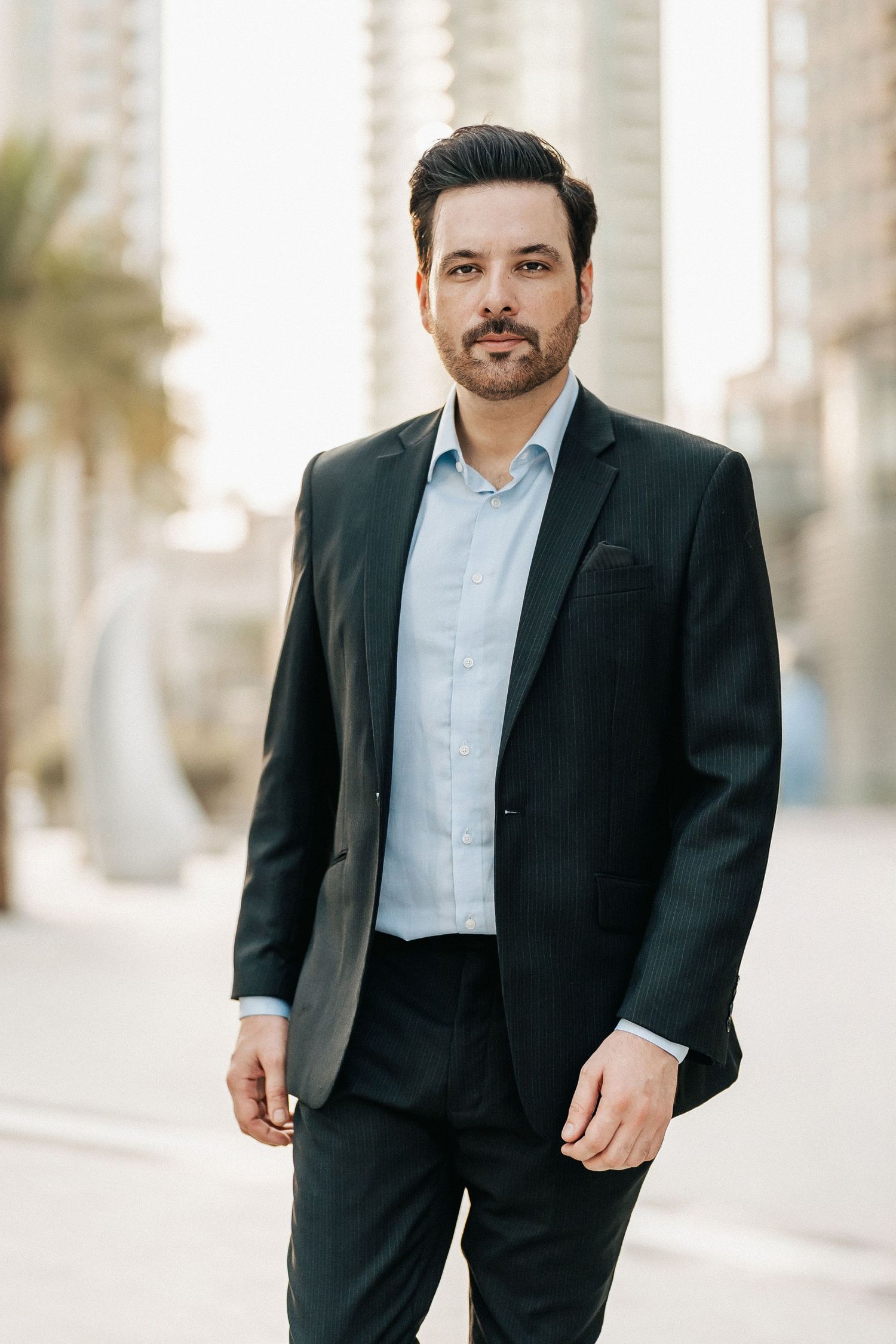 Portrait of actor Mikaal Zulfiqar in formal black suit