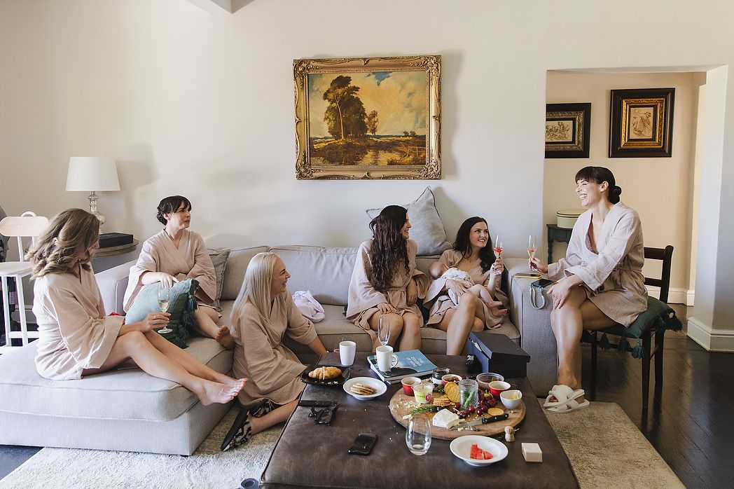Bride having breakfast and getting ready with bridal party