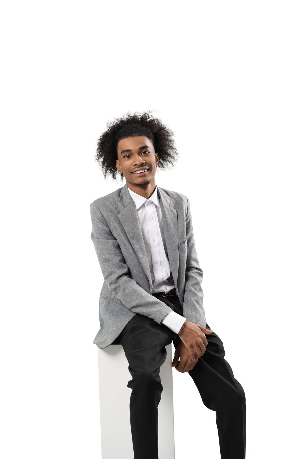 Person in business attire shows energetic movement and expressions in professional photo series.