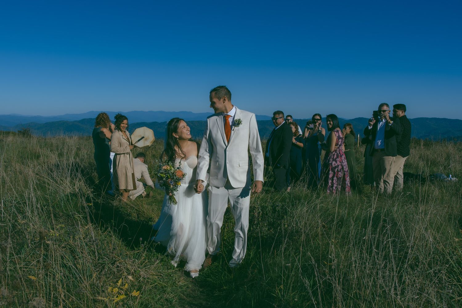 newly wed couple walking down aisle after microwedding ceremony in blue ridge mountains