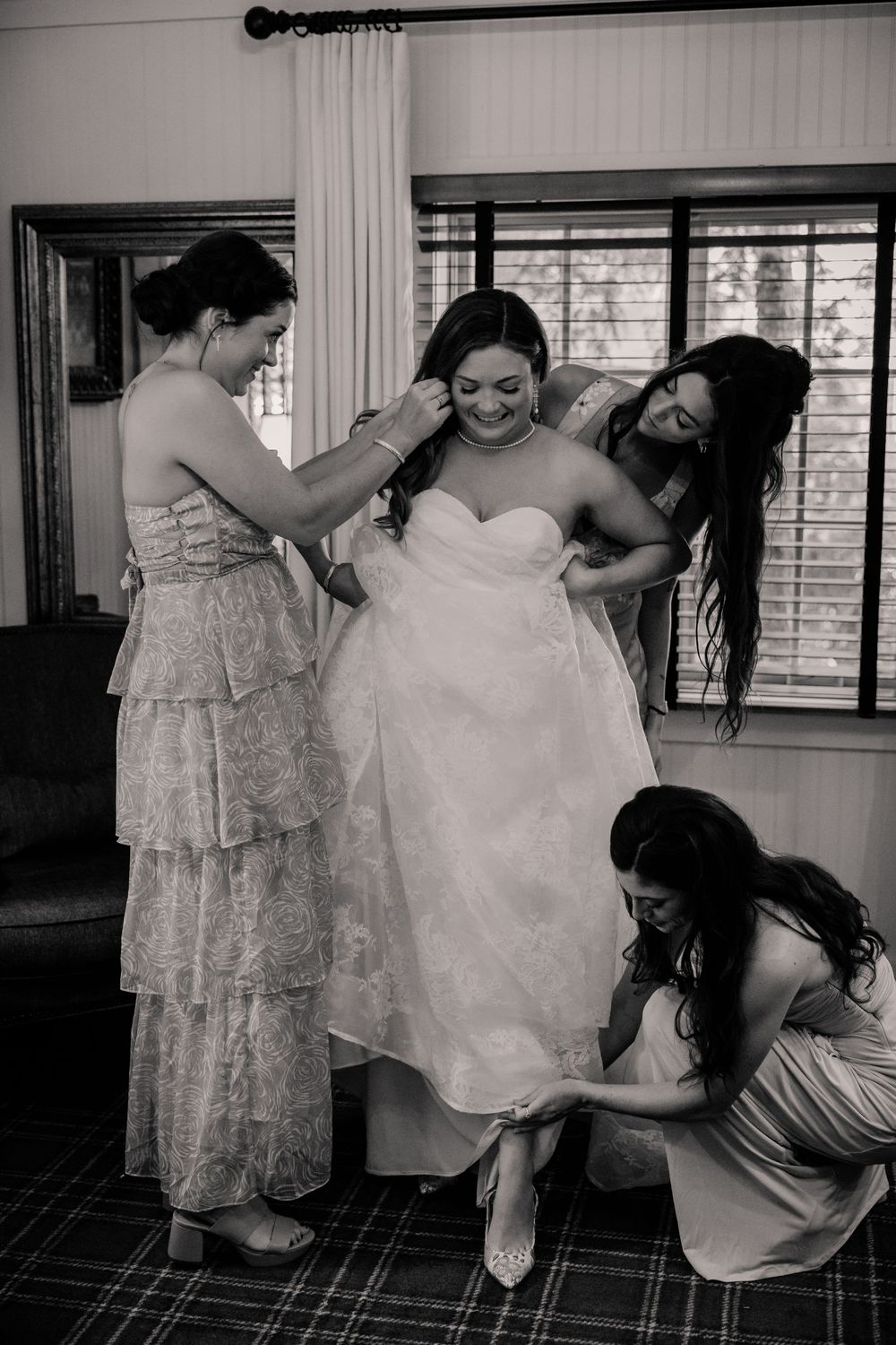 Series of black and white photos capturing intimate getting ready moments before the ceremony.