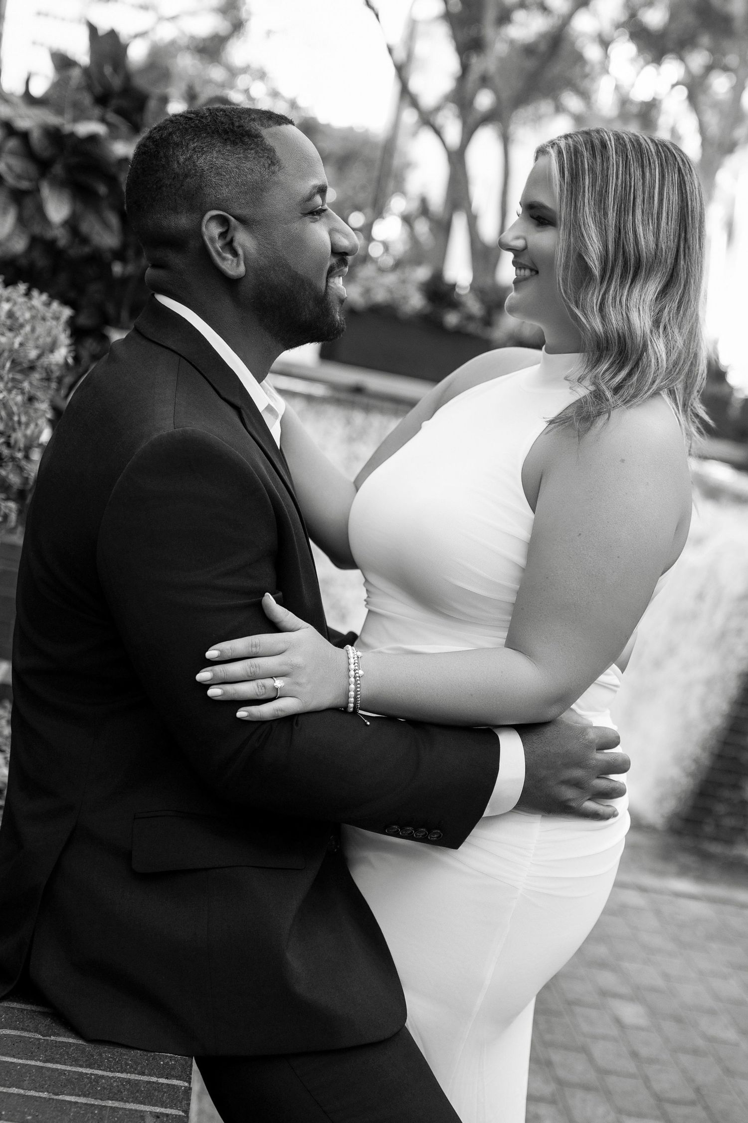 A romantic black and white photo series showing a couple dancing together at their wedding celebration in Downtown Tampa