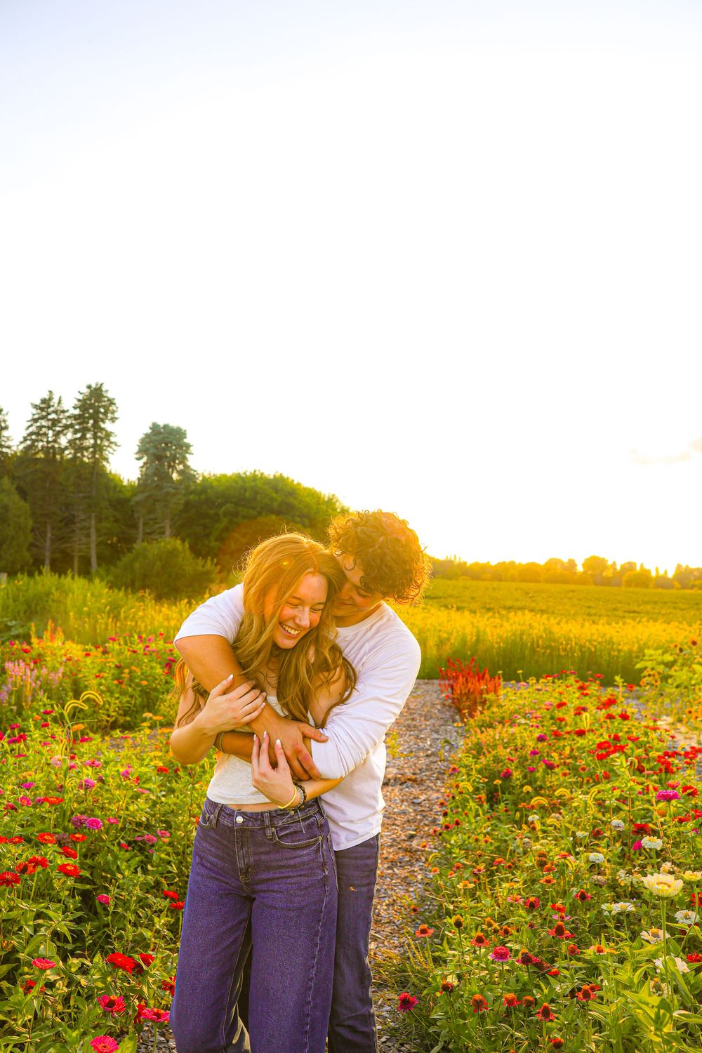 Candid couple photographer in flower field.