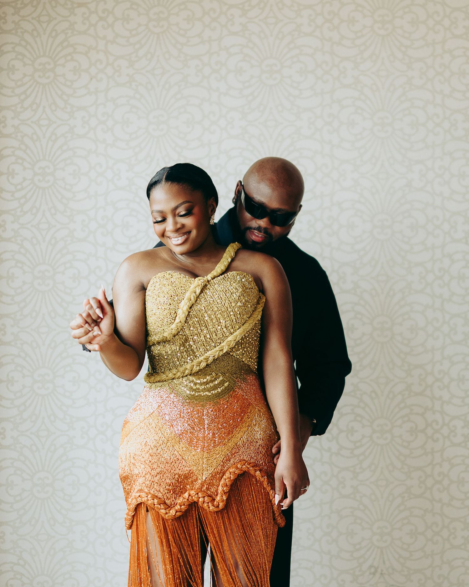 A wedding couple poses against a rustic wooden wall in a series of artistic minimalist portraits.