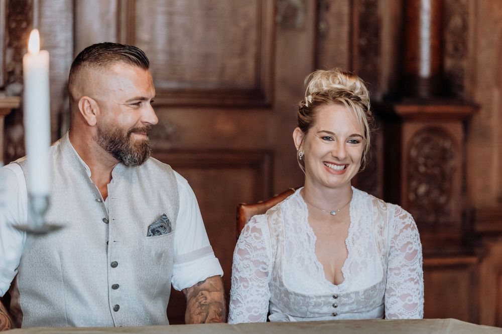 Joyful moment during traditional Bavarian wedding ceremony.