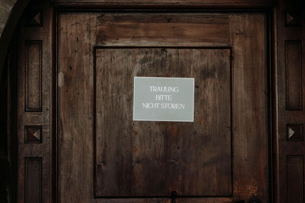 Dark wooden paneled hallway with vintage architectural details.