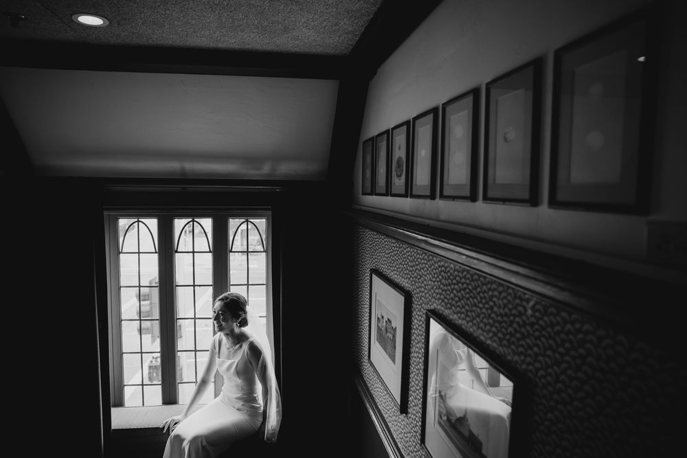 Intimate wedding portrait of the couple holding hands at Five Crowns Restaurant in Corona del Mar, California.