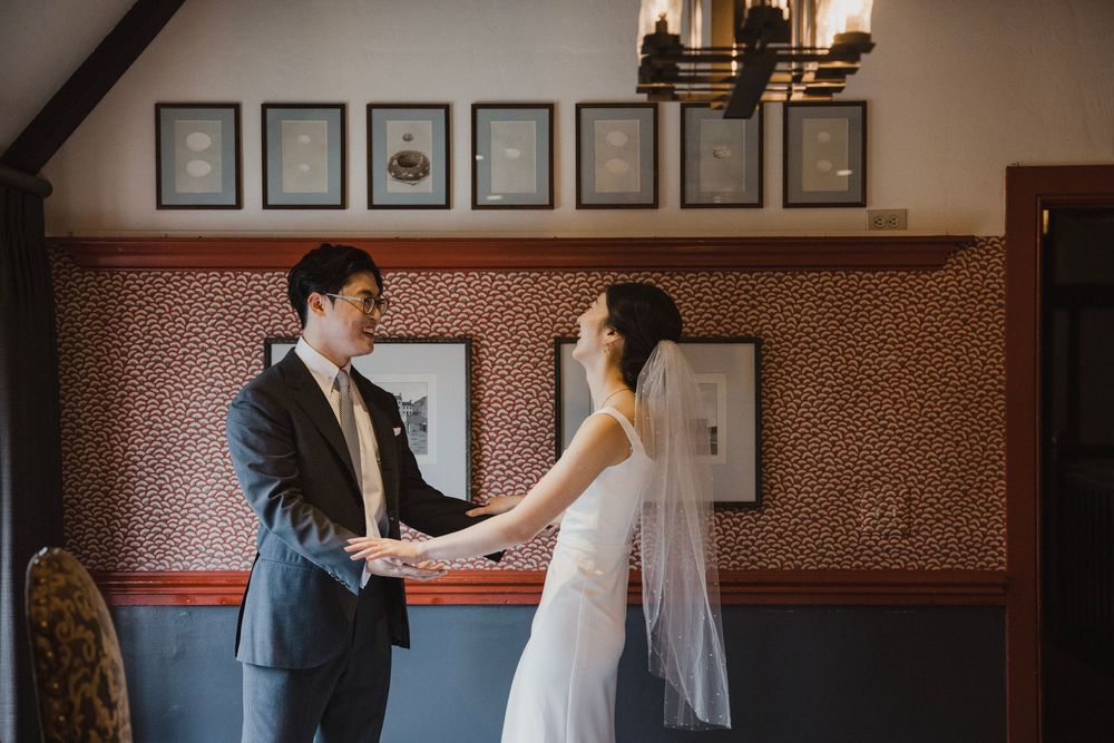 Newlyweds sharing a quiet kiss in the Five Crowns courtyard in Corona del Mar, CA.
