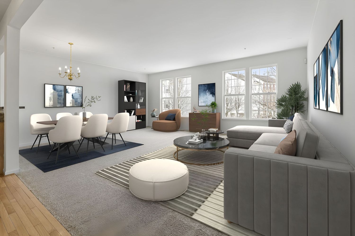 Contemporary living room with grey sectional sofa, modern lighting, and large windows providing natural light.