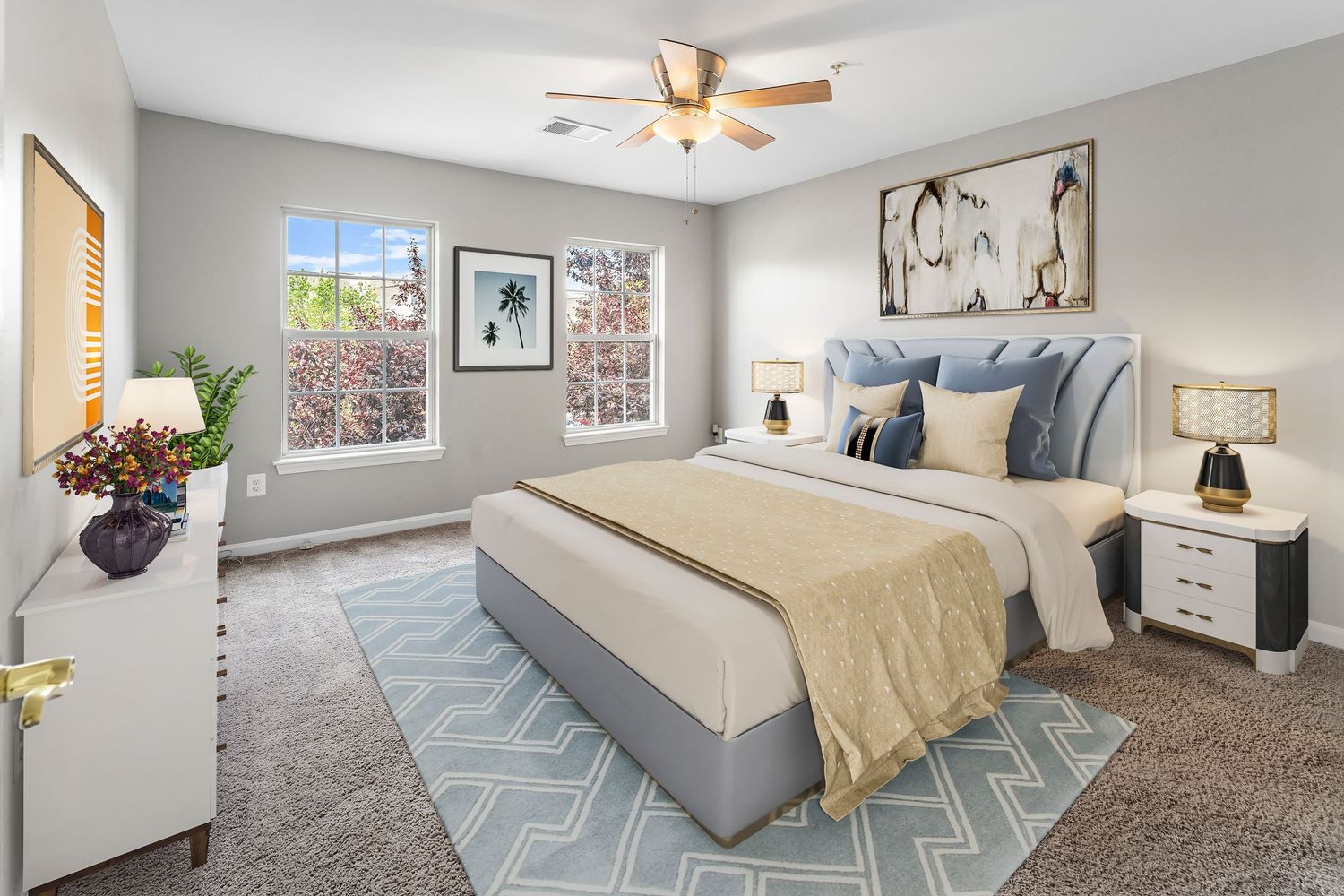 Stylish bedroom featuring grey carpet, contemporary furnishings, and geometric area rug.