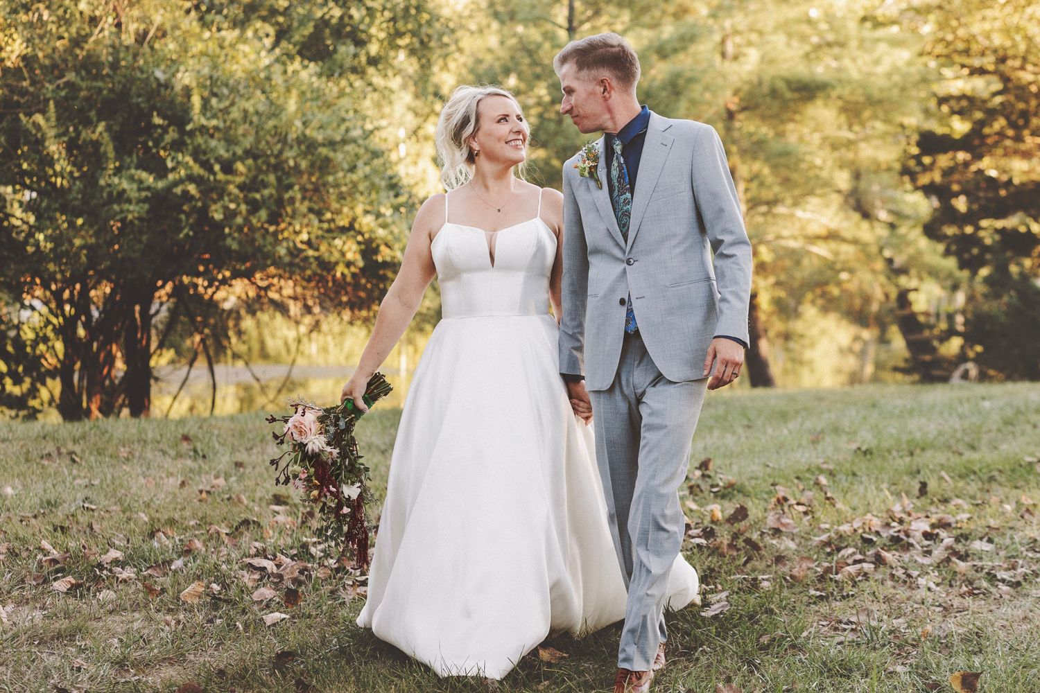 A romantic wedding couple shares intimate moments in a lush garden setting with soft natural lighting.