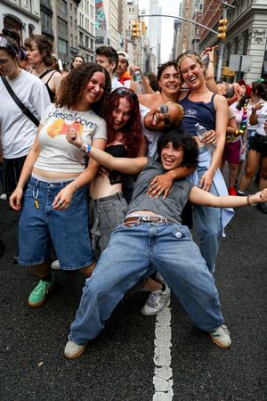 Group of lesbians celebrating at NYC Dyke March by queer life and event photographer Kade Joy.
