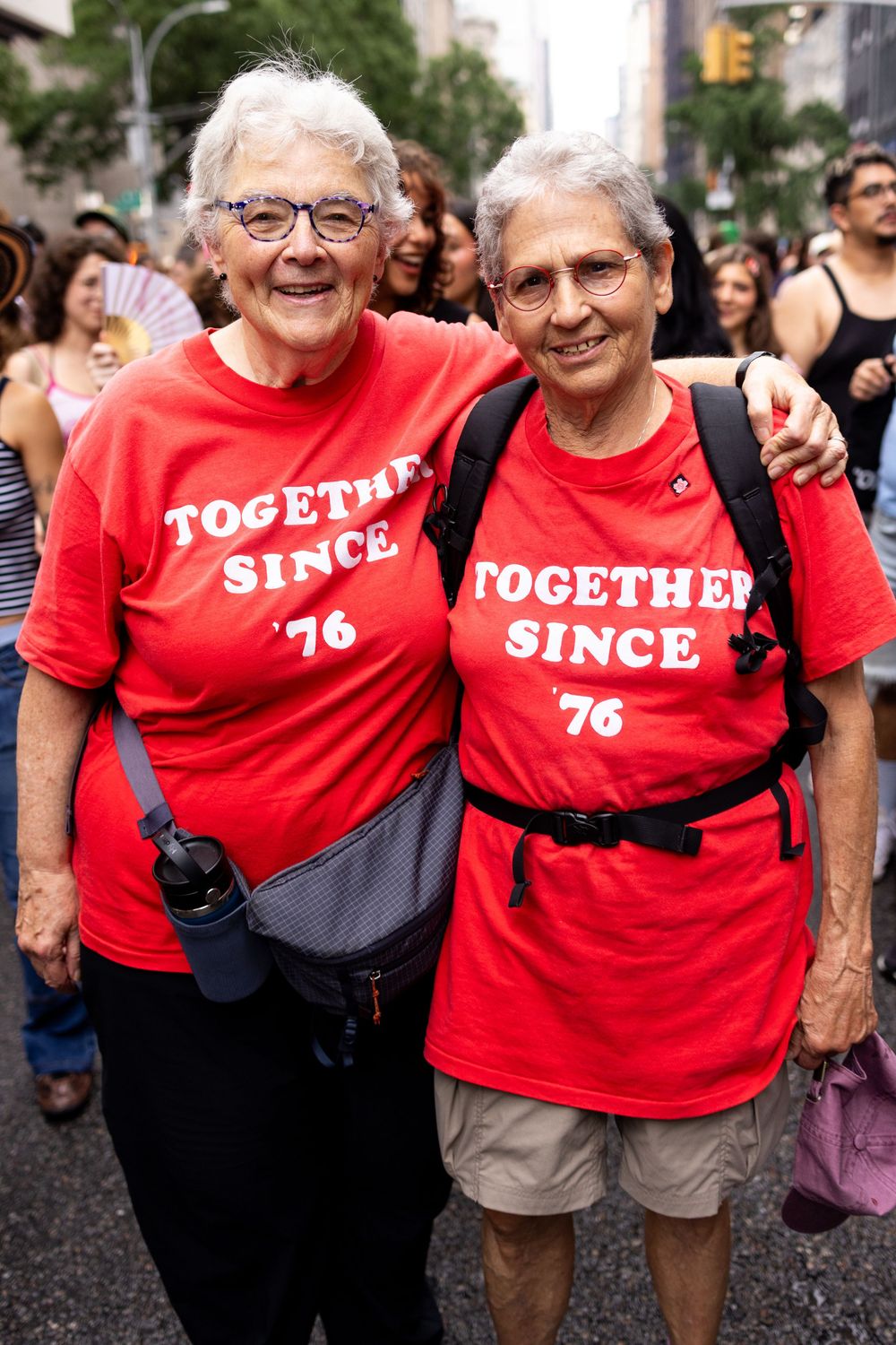 Two elder lesbians at New York City Dyke March photographed by trans queer event photographer Kade Joy.
