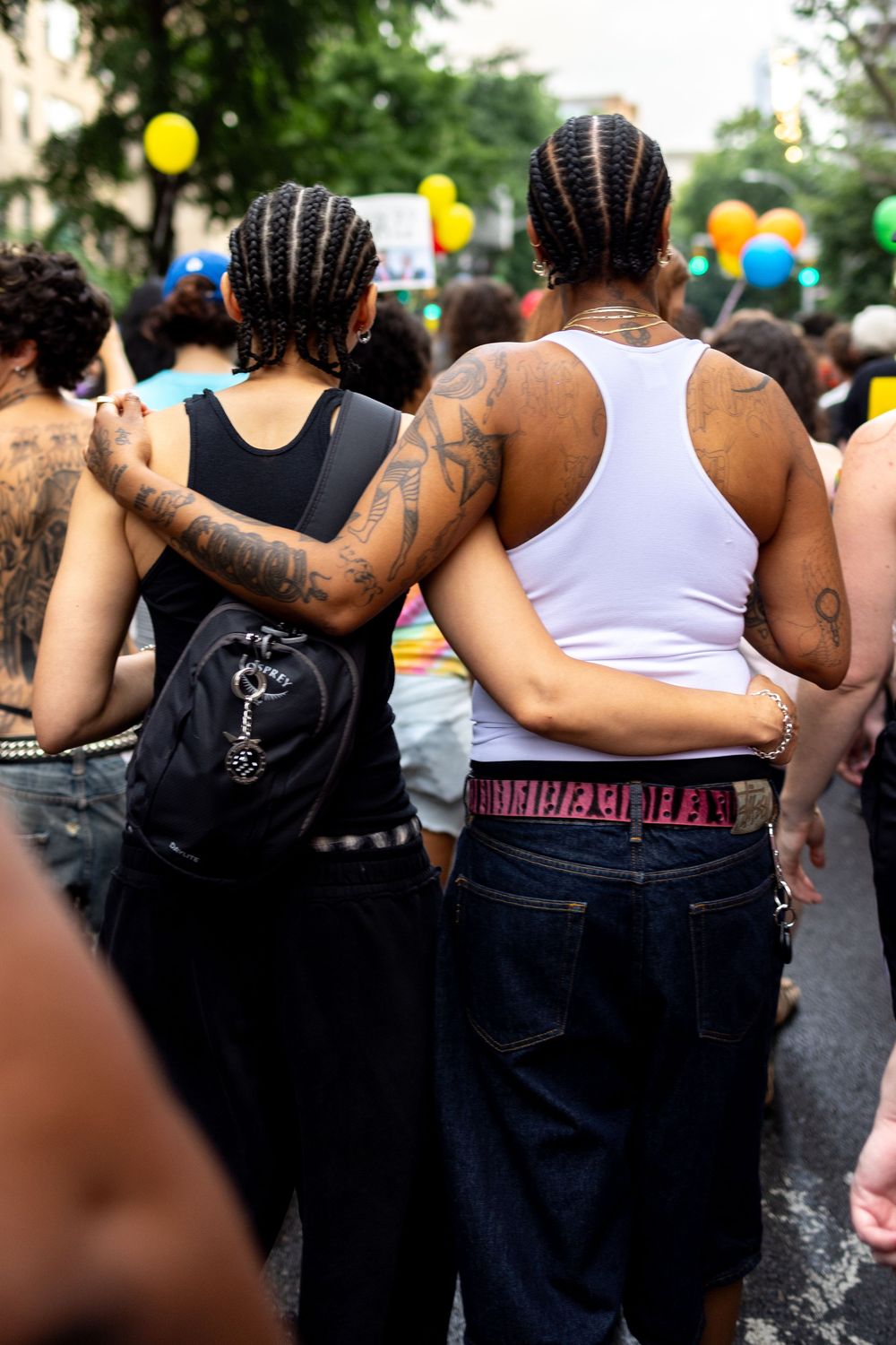 Lesbians at NYC pride event by queer / transgender documentary photographer Kade Joy.