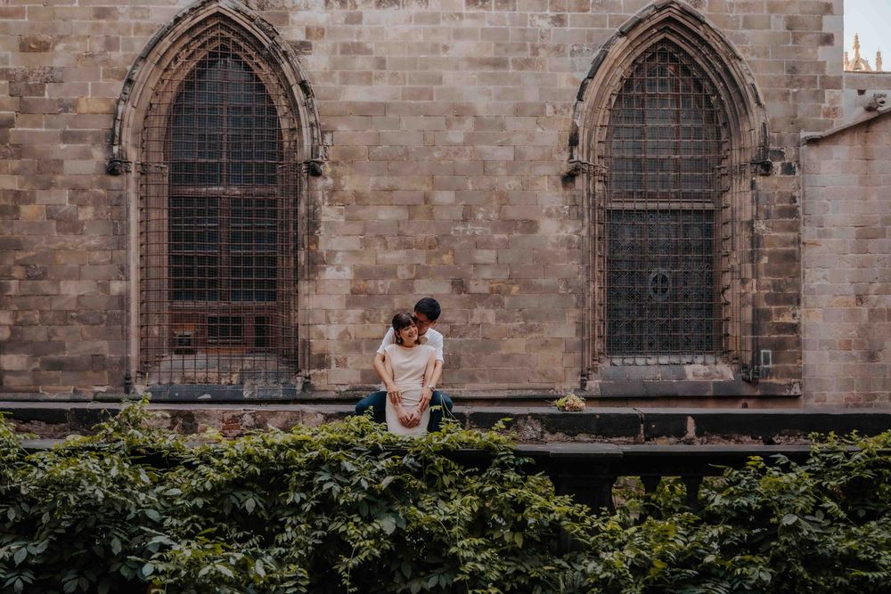 Sweet engagement portrait with lush green background in Ciutadella.