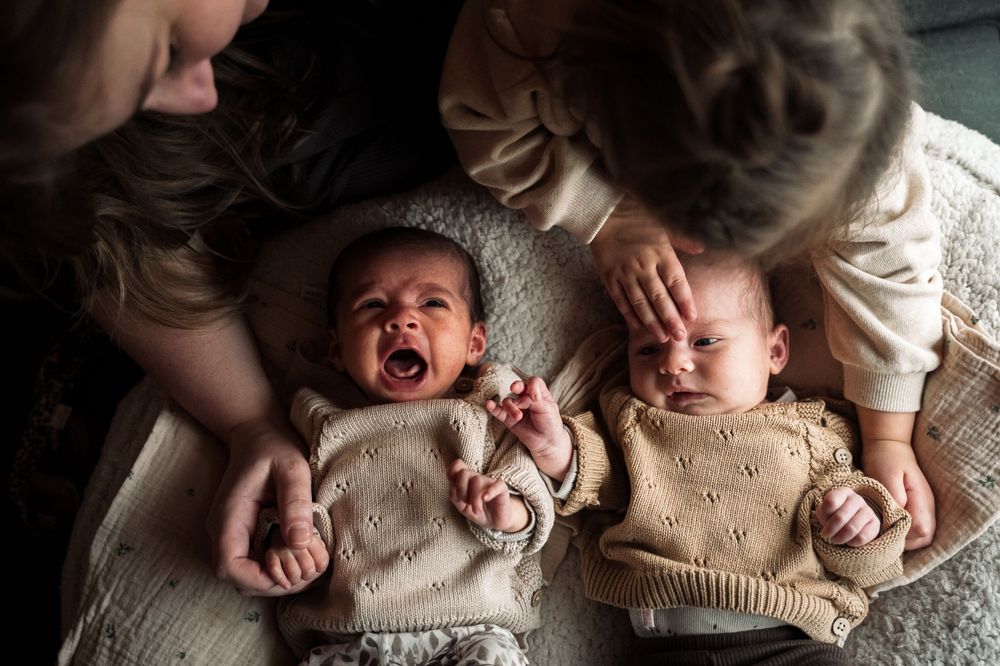 A series of candid lifestyle photos showing a baby lying on textured blankets and cushions in warm natural lighting.