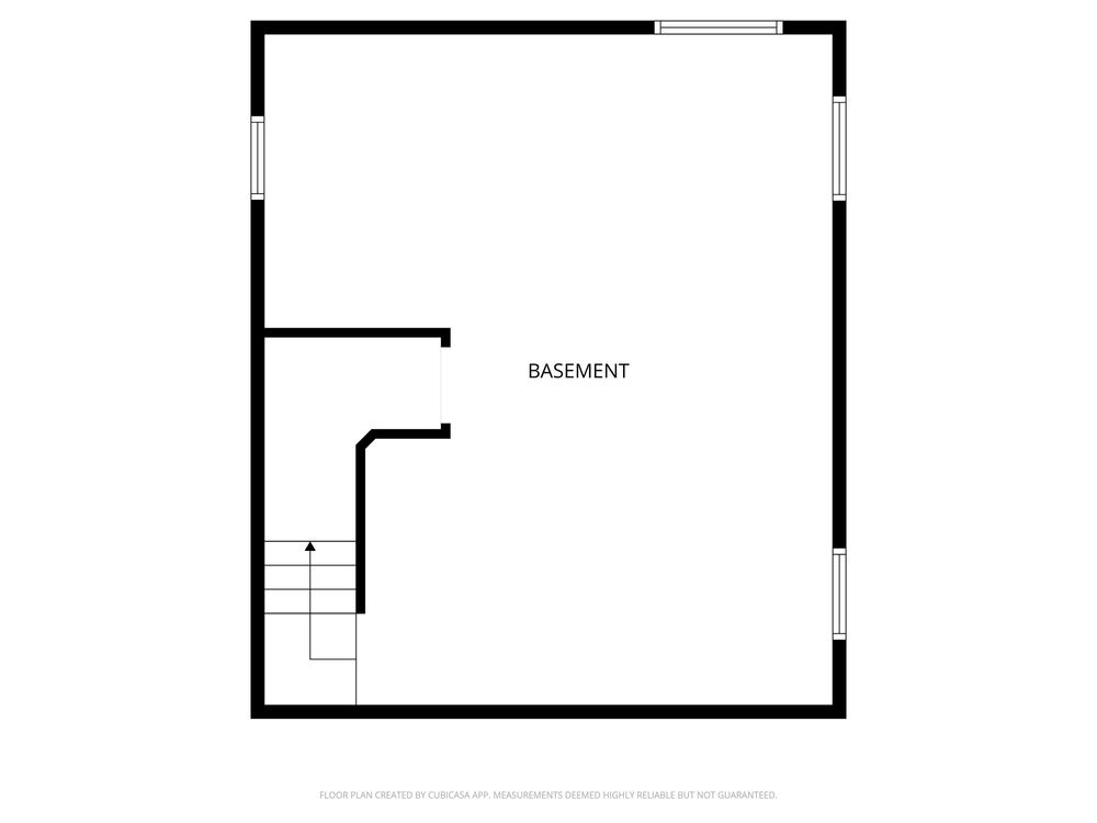 Simple basement floor plan showing open layout with staircase access and unfinished space.