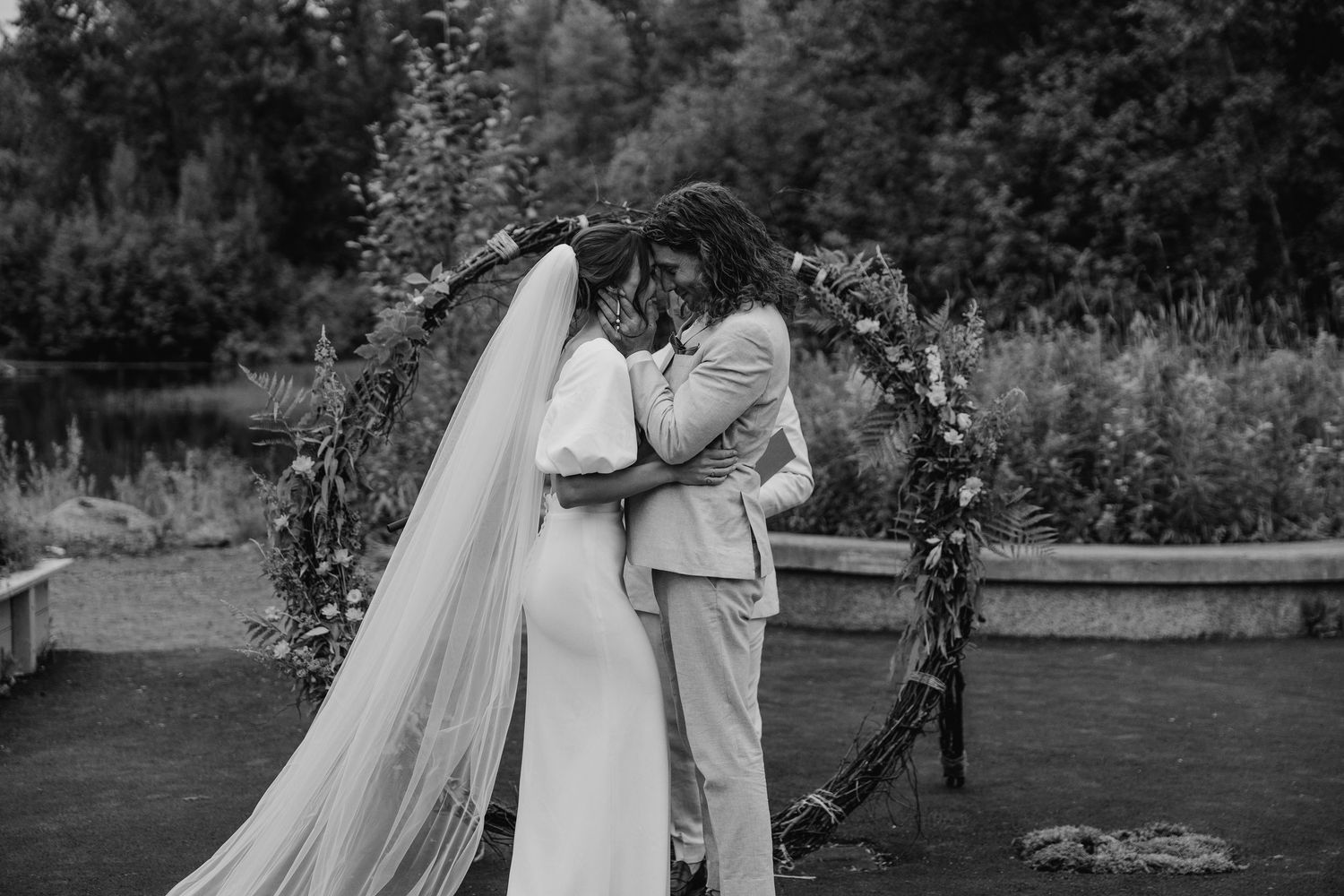 Bride and groom sharing first kiss | wedding photography