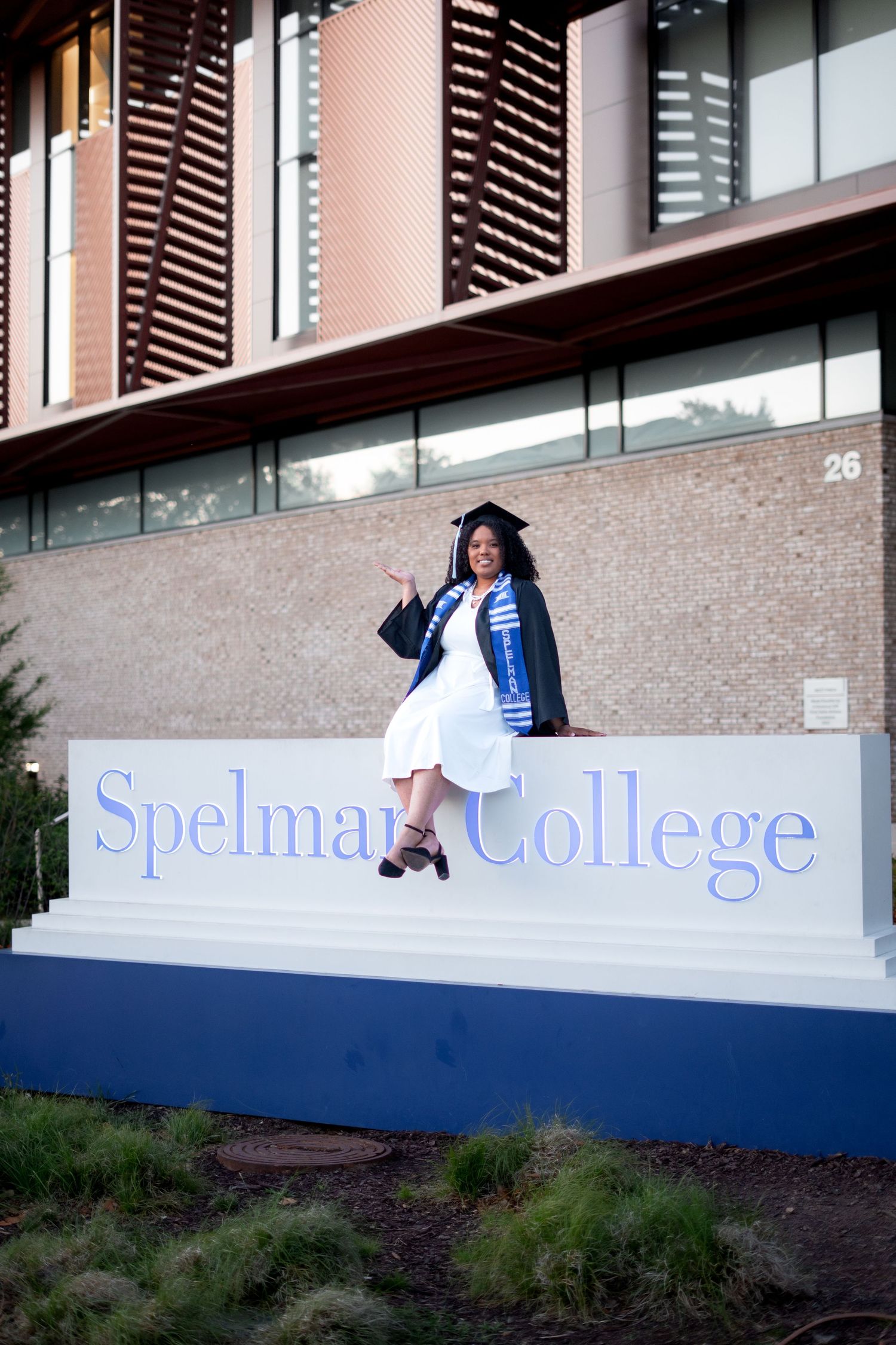 Spelman graduation photos in front of the iconic Spelman College Sign, one of the best spots on the Atlanta campus