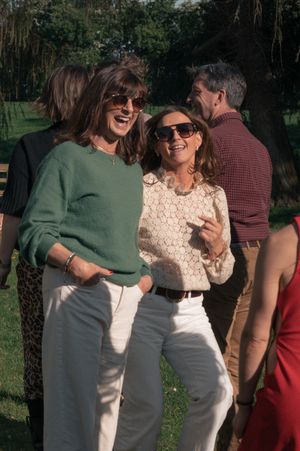 candid photo women dancing and laughing at family event photography
