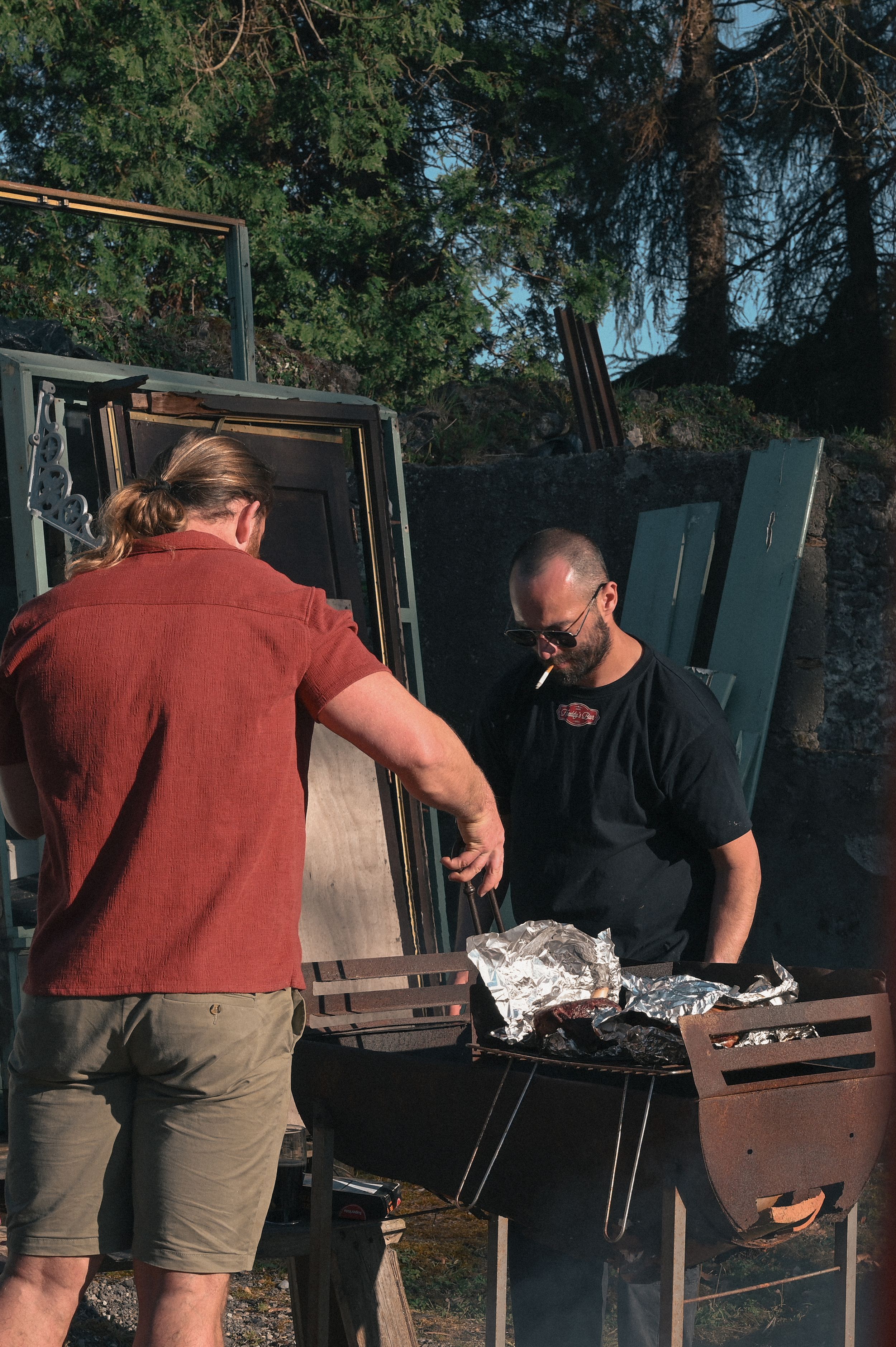 two men with bbq, candid family event photography