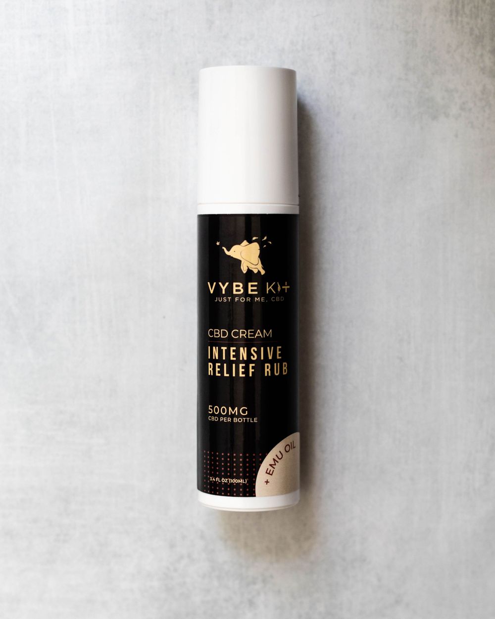 A black and white bottle of VYBE CBD intensive relief cream against a light gray background.
