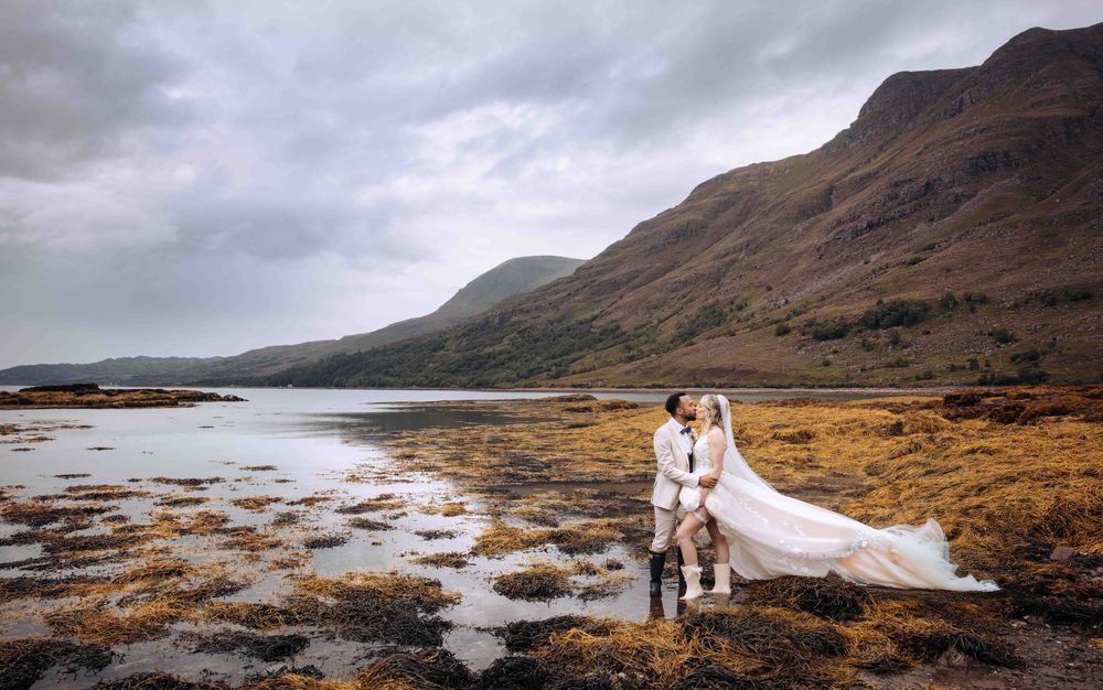 Dramatic panoramic sequence of a Scottish Highland coastline with rugged mountains and moody skies during sunset.
