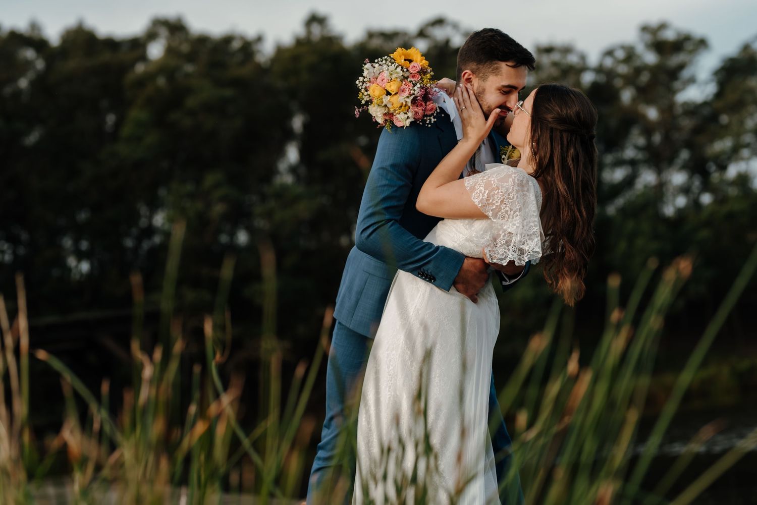 Romantic wedding photos taken outdoors with natural lighting and greenery.