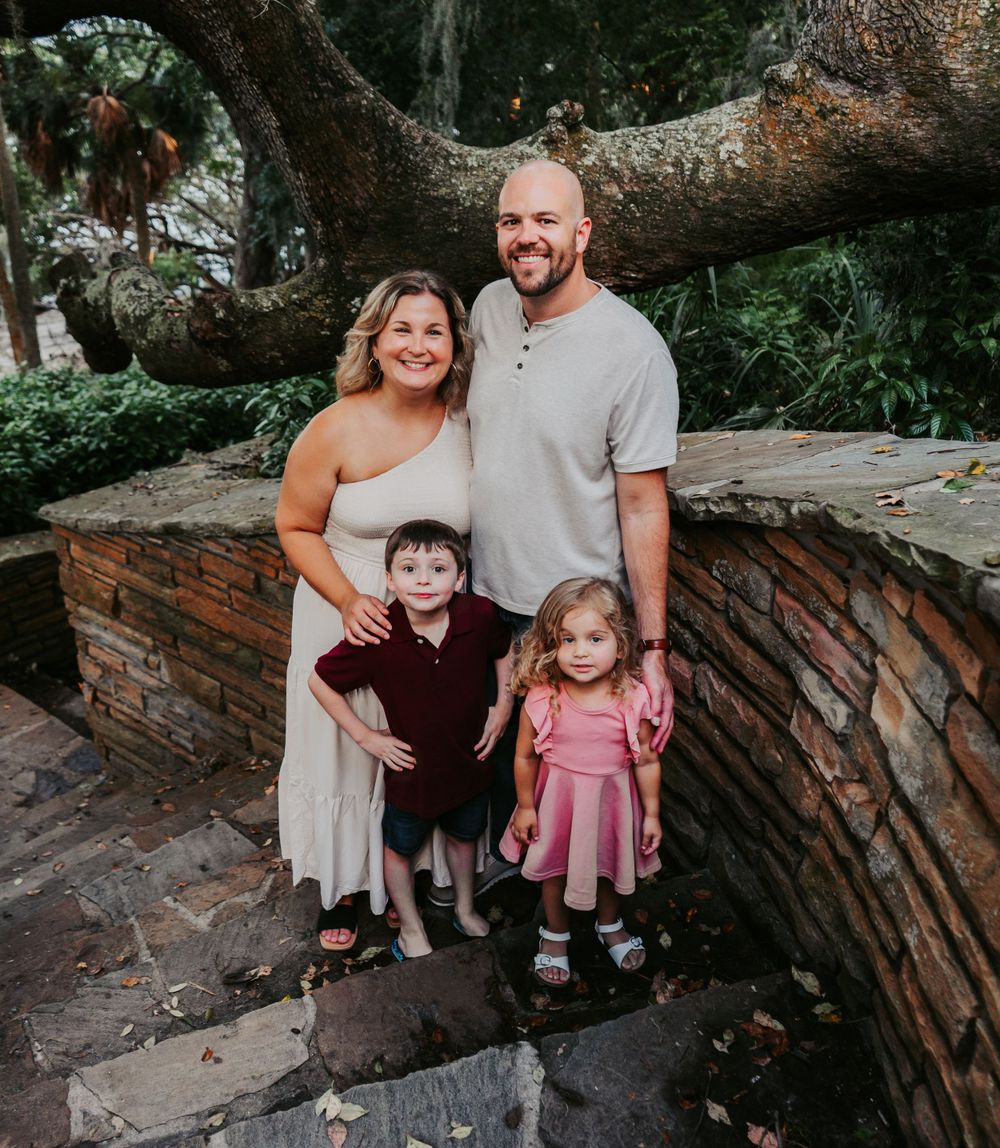 Outdoor Family Session Philippe Park in Safety Harbor, FL; family posing on stone stairs