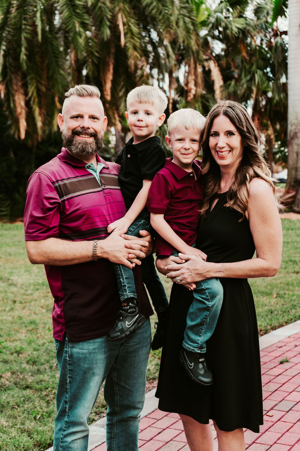 Outdoor Family Session Gisela Kopsick Arboretum in Saint Petersburg, FL; Family posing together on brick path