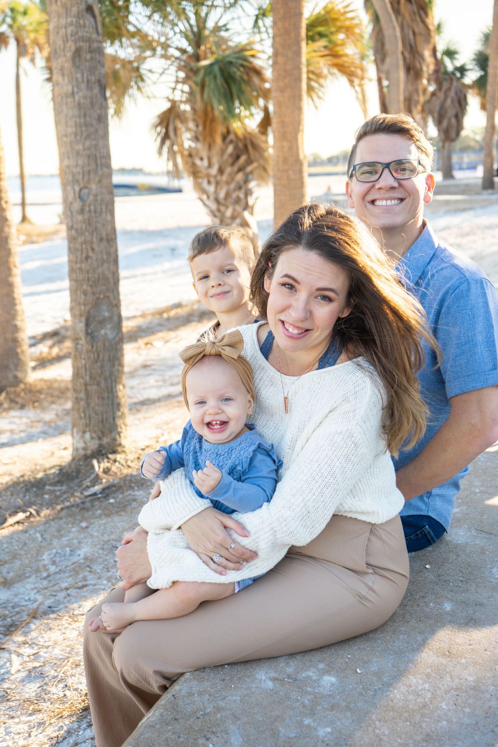 Outdoor Family Session Gisela Kopsick Arboretum in Saint Petersburg, FL; Family posing together on beach