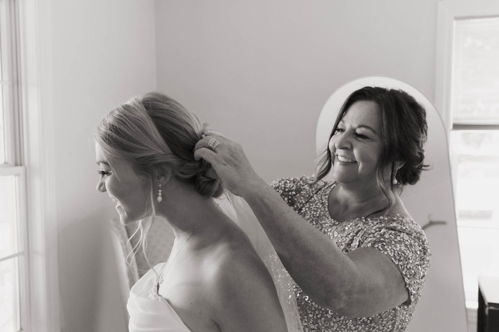 Bride getting ready photos with mom captured by photographer Autumn Case with DreamStudios LLC out of Toledo ohio
