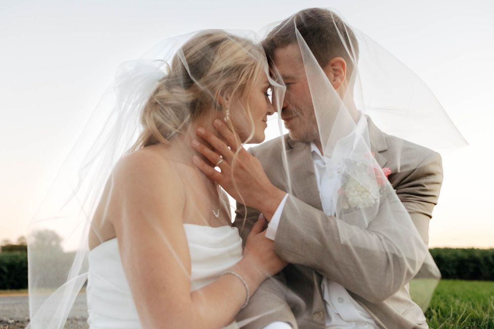 DreamStudios wedding photography in Toledo Ohio. Creative bride and groom shots with veil