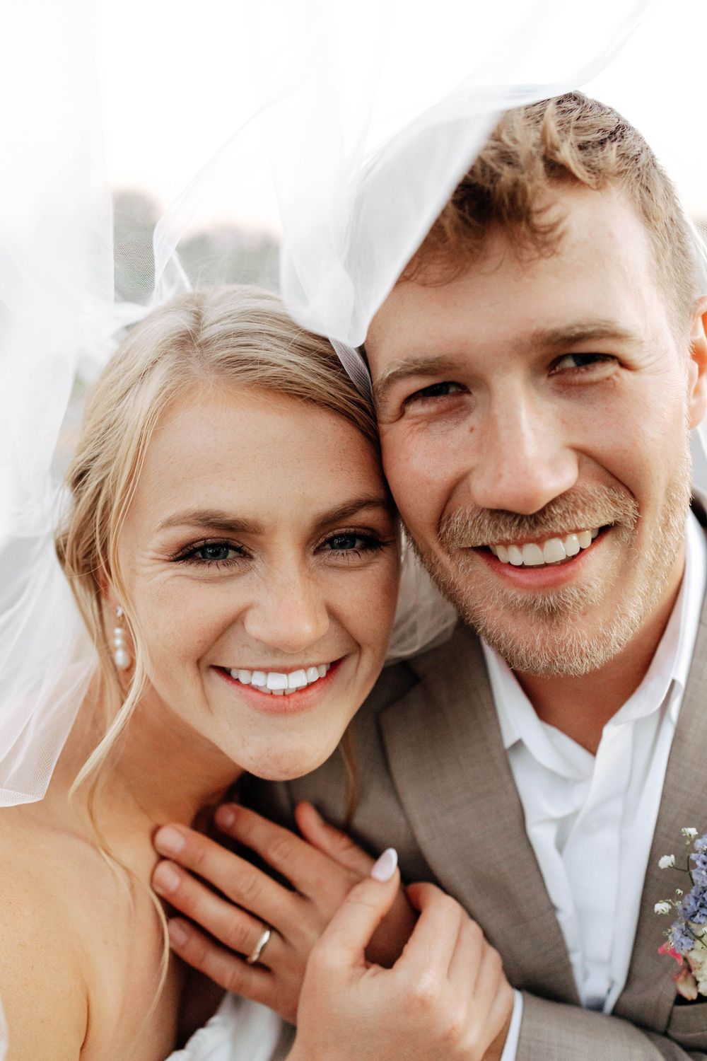 DreamStudios wedding photography in Toledo Ohio. Creative bride and groom shots with veil