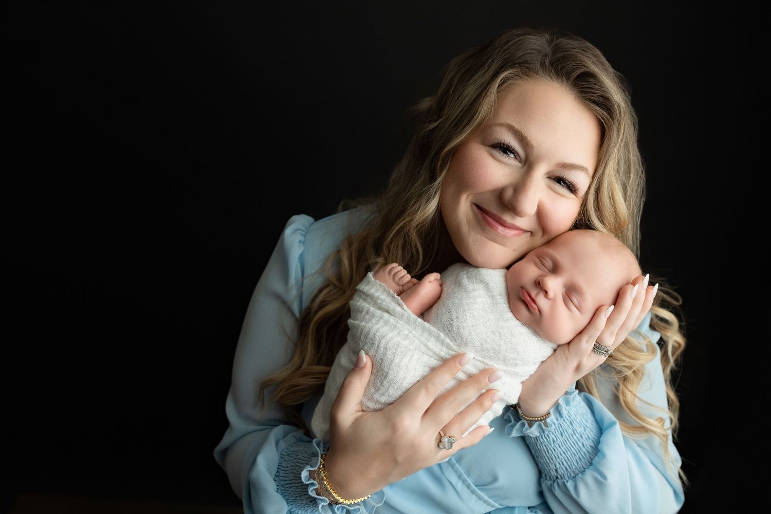 Mother cuddling her newborn baby during studio session – Greenville SC newborn photographer Easley SC area. Greenville SC newborn