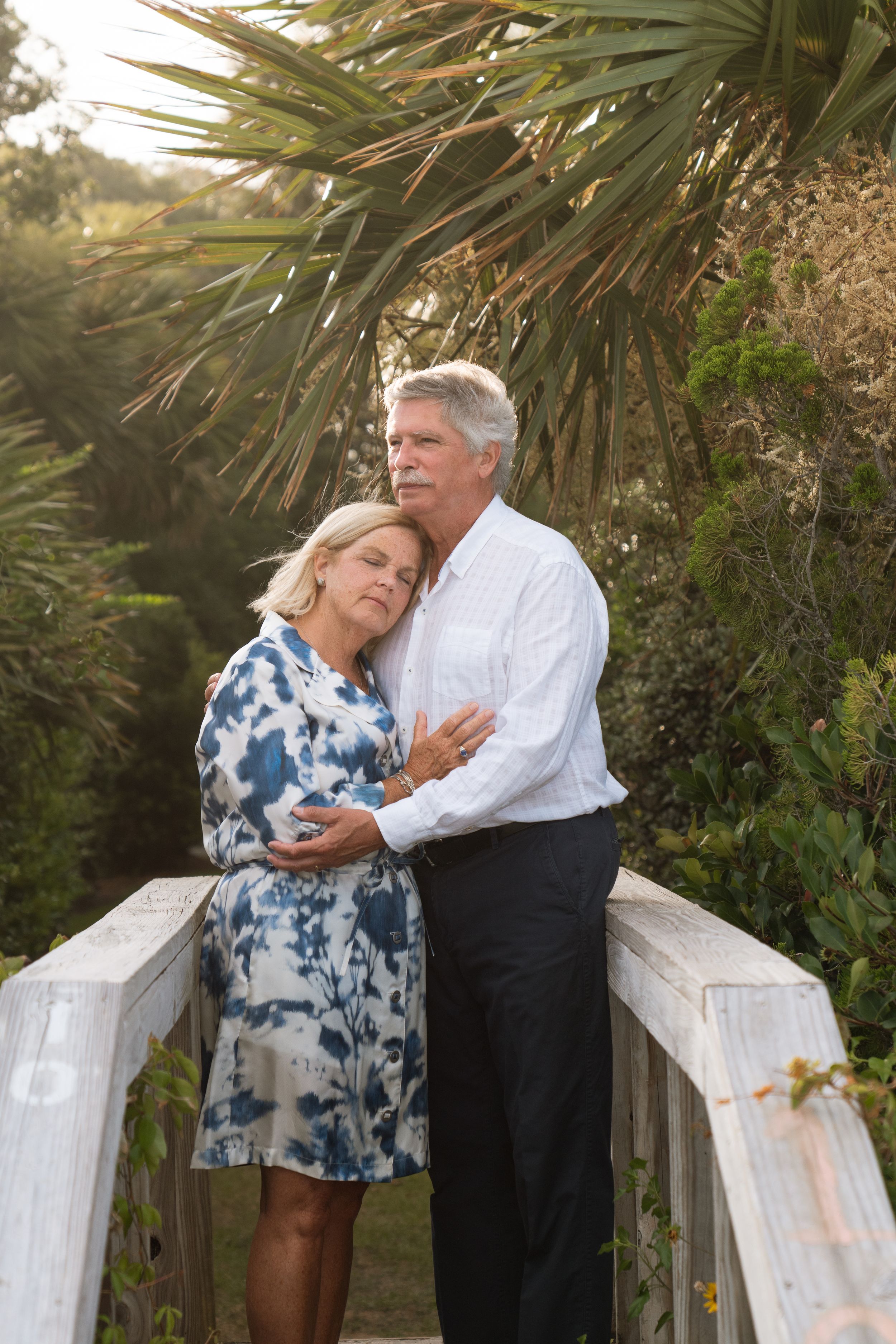 Older couple holding each other during an anniversary portrait session