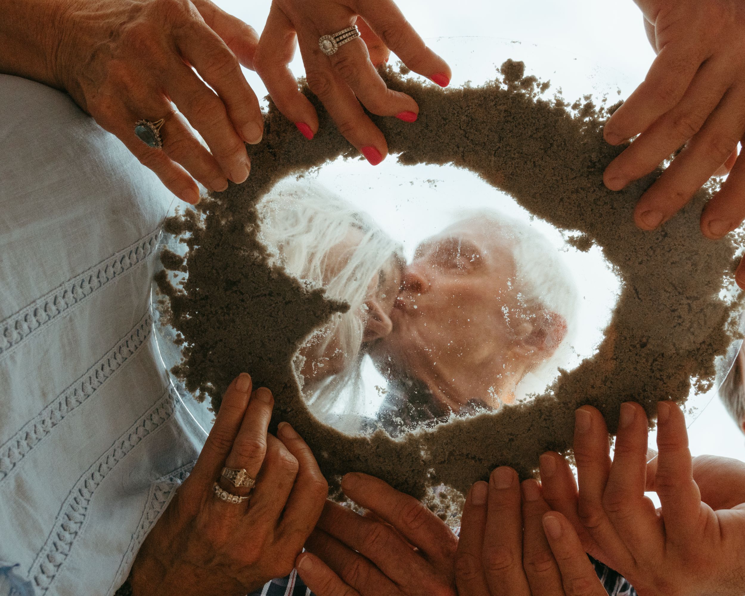 Unique close-up of a couple embracing for their anniversary photos