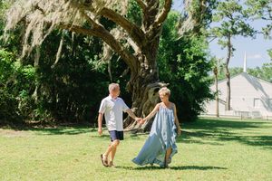 Anniversary portrait of a couple laughing together outdoors