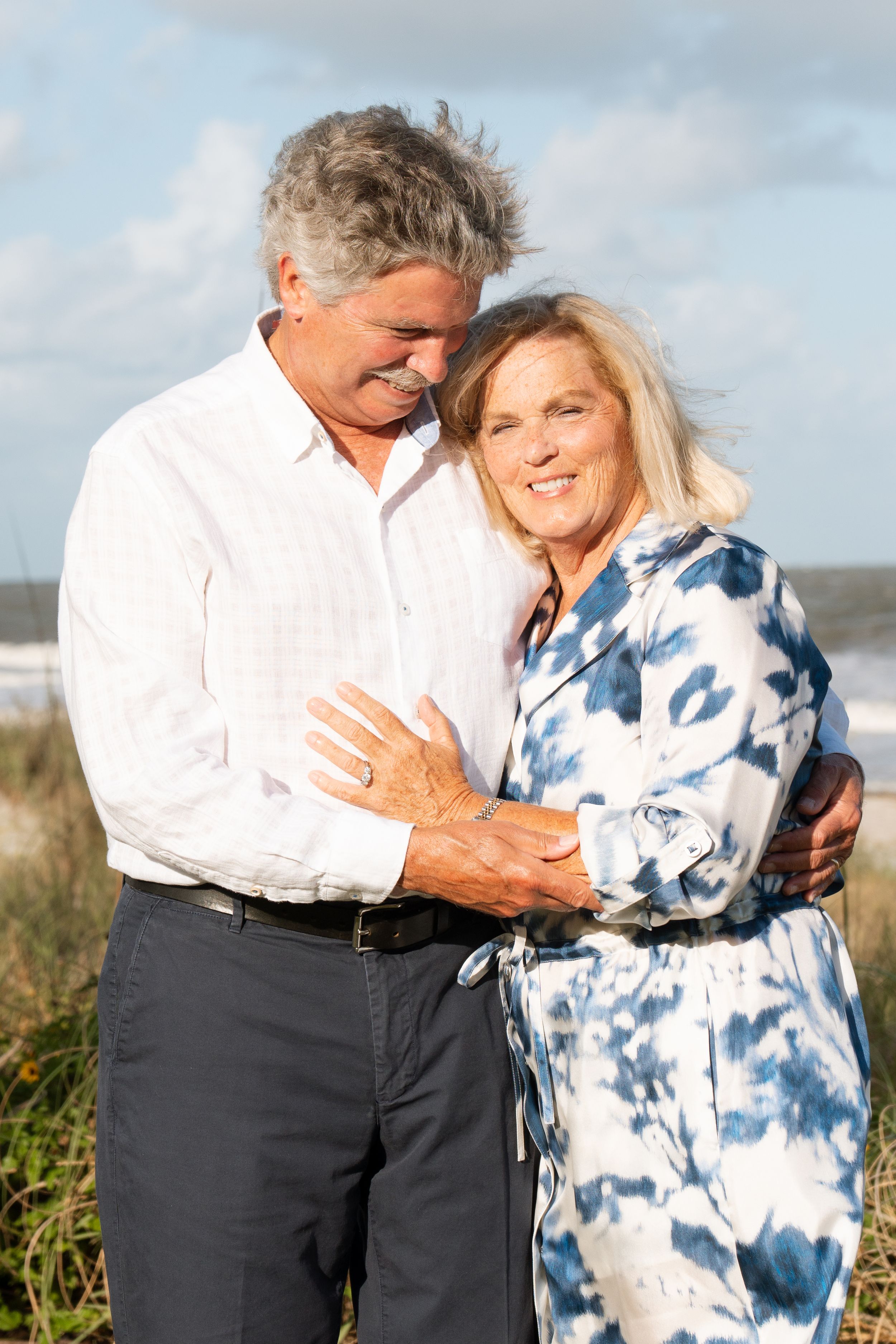 Older couple holding hands during an anniversary portrait session