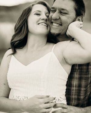 Close up black and white portrait of a romantic couple sharing an intimate moment together.