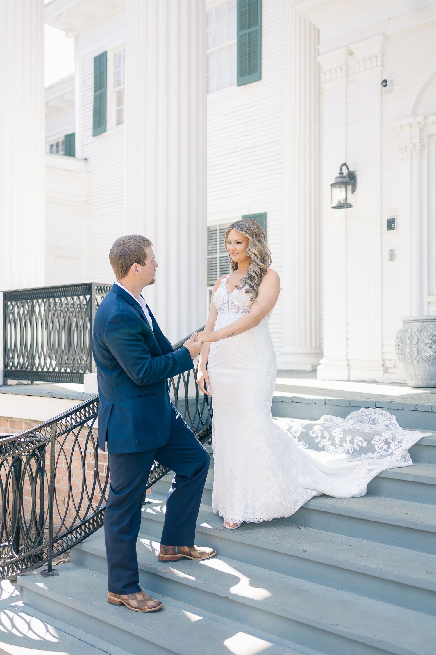 Black and white wedding portraits showing intimate moments between newlyweds in an outdoor setting.