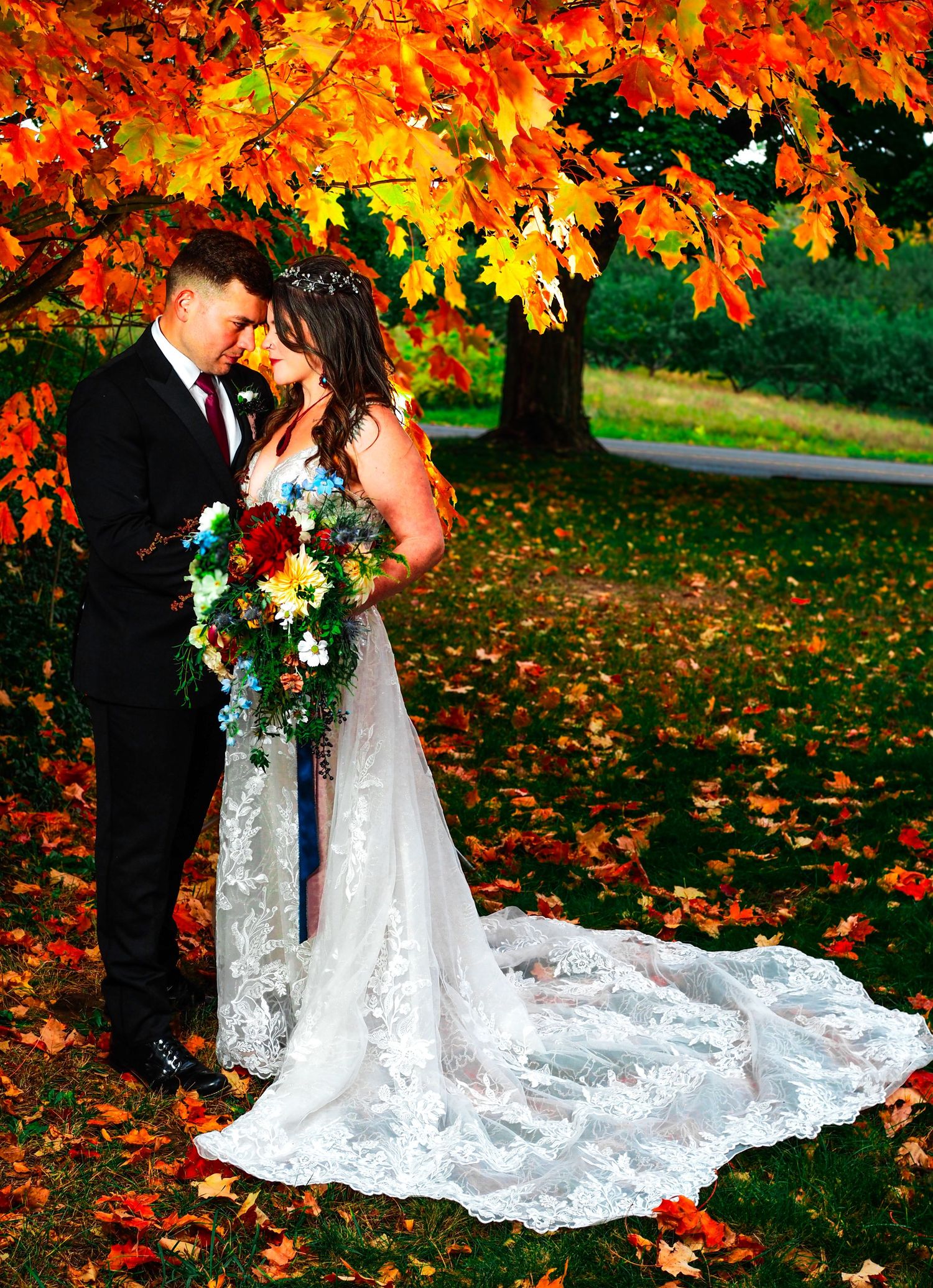 fall wedding photo with orange leafs
