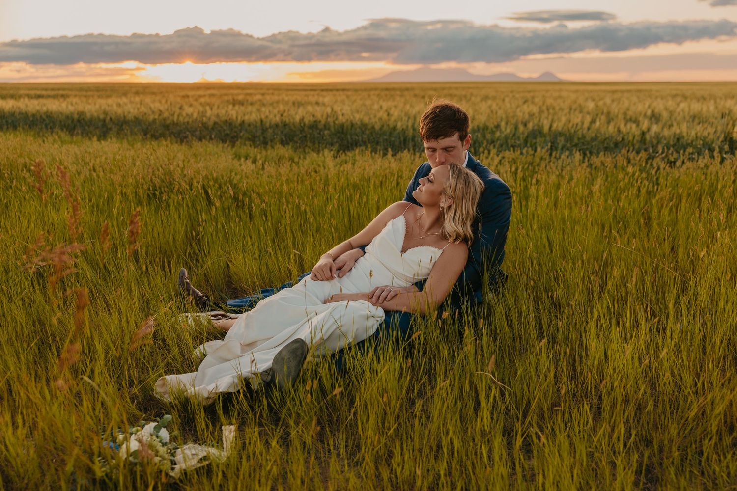 Montana Wedding Photographer captures couple on Hi-line, roaming through wheat fields. Montana Paradise Valley Wedding Photographer
