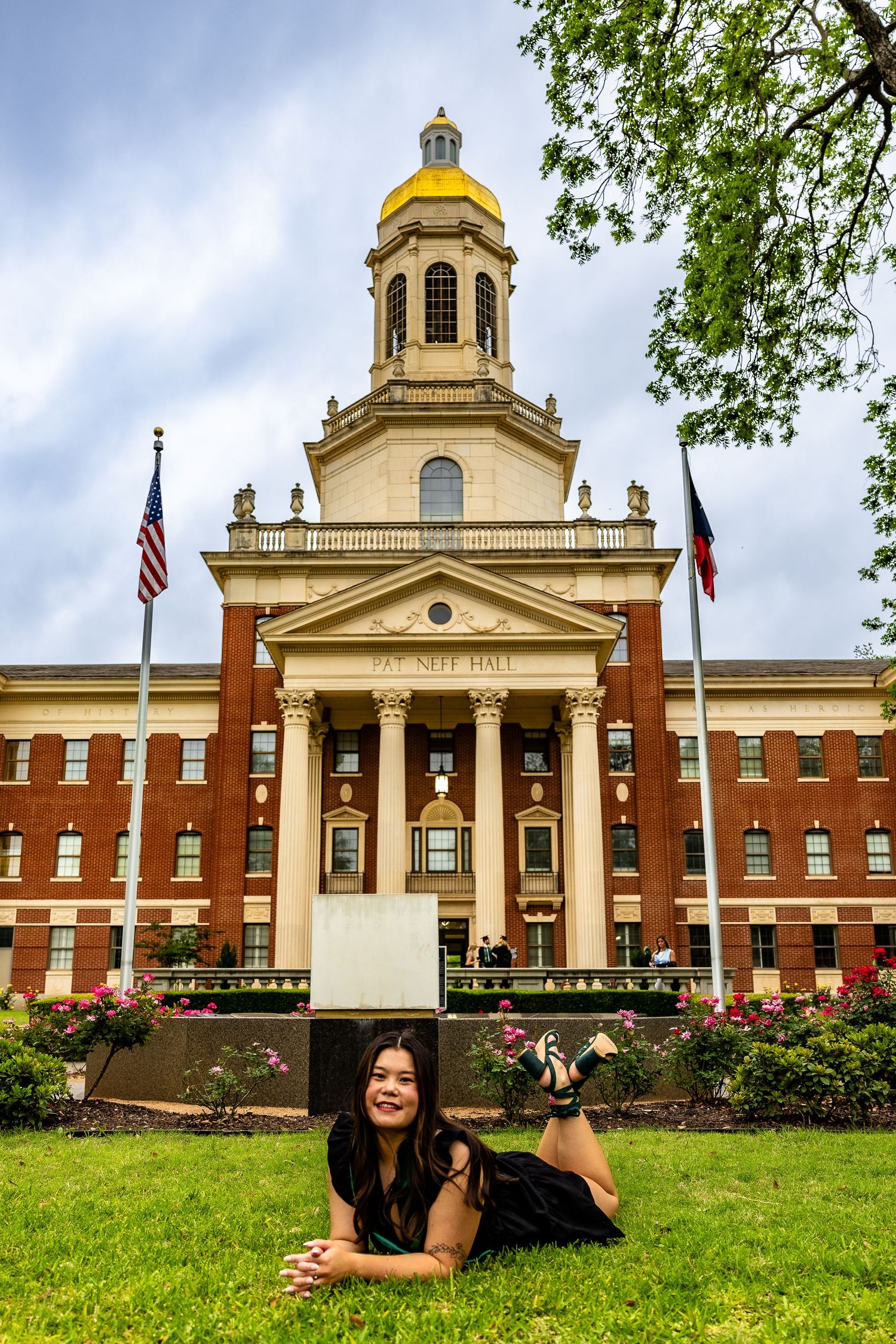 A panoramic collage showing a historic brick building with golden domes and columns on a grassy lawn with American flags.