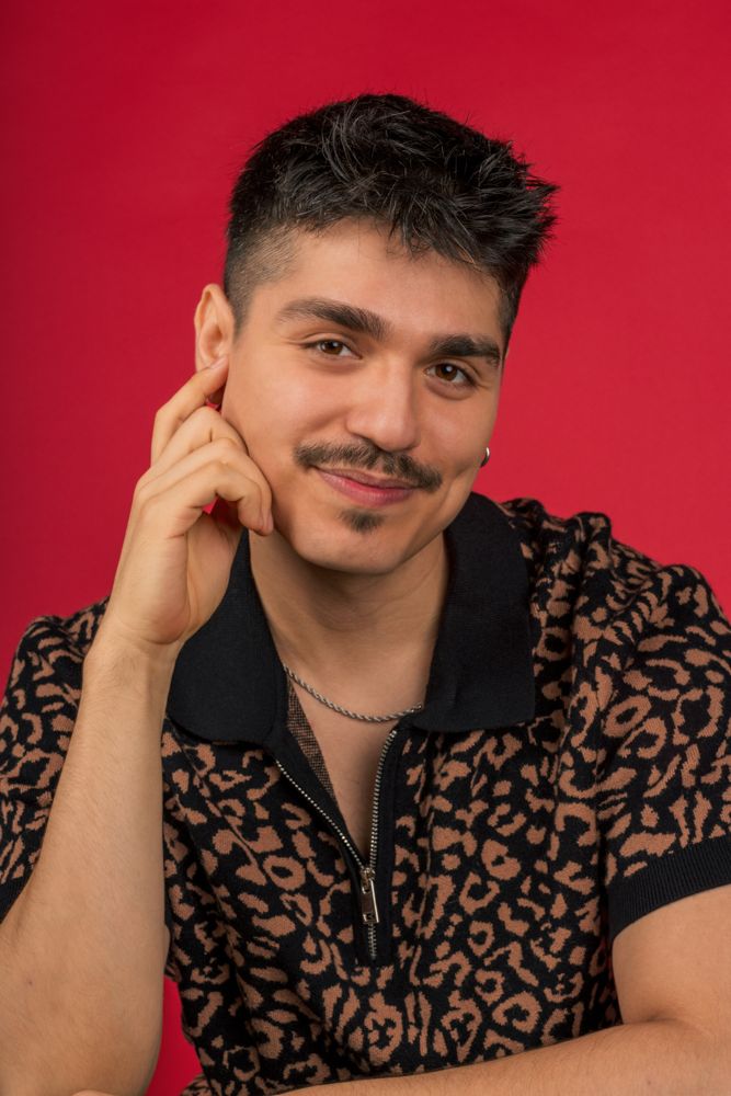 Stylish black and tan patterned shirt shown in multiple poses against red background.